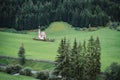 St Magdalena church in Val di Funes valley, Dolomites, Italy. Furchetta and Sass Rigais mountain peaks in background Royalty Free Stock Photo