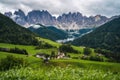 St Magdalena church in Val di Funes valley, Dolomites, Italy. Furchetta and Sass Rigais mountain peaks in background Royalty Free Stock Photo