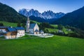 St Magdalena church in Val di Funes valley in evening dusk light, Dolomites, Italy. Furchetta and Sass Rigais mountain Royalty Free Stock Photo