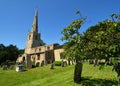 St Margarets church at Hemmingford Abbots Cambridgeshire England blue sky and grave stones.
