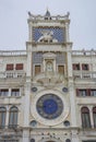 St. Mark Clock Tower Torre dell Orologio with Astronomical clock and winged lion statue in San Marco Square, famous tourist Royalty Free Stock Photo