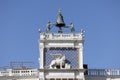 St Mark\'s Clock tower on Piazza San Marco, Lion of Saint Mark relief on facade, Venice, Italy Royalty Free Stock Photo