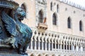 St Mark`s Square or Piazza San Marco, Venice, Italy. Detail with bronze sculpture of winged lion, symbol of Venice Royalty Free Stock Photo