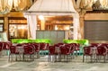 St Mark Square at night in Venice. Outdoor restaurant seats