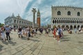 St. Mark Square, VENICE, ITALY - August 02, 2019: Torre dell Orologio, Basilica and Museum San Marco Locals and tourists strolling Royalty Free Stock Photo