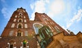 St. Mary`s Basilica on the Krakow Main Square Rynek Glowny during the sunrise, Poland