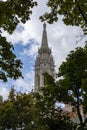 St. Matthias Church in Budapest, Hungary. Blue sky and blue sky. Tree branches