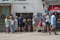 Take away traditional fish and chip shop, customers queueing.