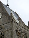 US Paratrooper dummy hanging from church tower to remember 82nd division airborne operations beginning of D-Day landings in Norman