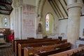 St Michaels Church, Amberley, Sussex. Interior showing 14th century wall paintings. Royalty Free Stock Photo