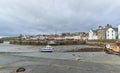 St Monans harbour at low tide with the Fishing houses overlooking the Boats in the Mud. Royalty Free Stock Photo