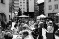 St. Moritz Food Festival: local people and tourists sitting outside and getting food from the stands around