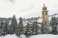 View to the inclining bell tower in the ski resort town of St. Moritz, Switzerland.