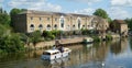 The river Ouse at St Neots with boats and river side houses.