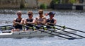 Ladies fours Sculling on river close up.