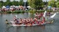 Three Dragon Boats in race on the river Ouse at St Neots Cambridgeshire. Royalty Free Stock Photo