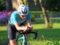 Close up of Male Triathlon Competitor on cycling stage of event