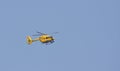 East Anglian Air Ambulance against blue sky. Royalty Free Stock Photo