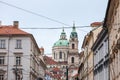 St Nicholas Church, also called Kostel Svateho Mikulase, in Prague, Czech Republic, with its iconic dome seen from nearby streets