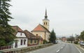 St. Nicholas Church standing on the road passing through the village of Bunesti in Romania