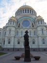 St. Nicholas Naval Cathedral in Kronstadt in autumn with Monument to Admiral Ushakov in front of it