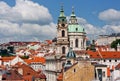 St. Nicolas churc over old town red roofs Prague Royalty Free Stock Photo