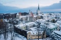 St. Olaf church and old town of Tallinn before winter-time sunrise