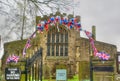 St Oswalds Church, Askrigg, Yorkshire, England Decorated for the coronation of King Charles III Royalty Free Stock Photo