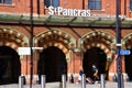 St Pancras International Station entrance with person wearing face mask London