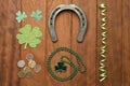 St. Patrick concept. Some green and lucky objects in a wooden background. Royalty Free Stock Photo