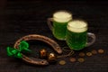 St. Patrick Day concept. Glasses of green beer. On wood dark table Royalty Free Stock Photo