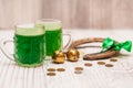 St. Patrick Day concept. Glasses of green beer. On wood light table Royalty Free Stock Photo