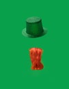 St. Patrick Day concept. Irish glittery hat and ginger curly beard on green background.