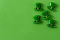 St. Patrick Day symbols on green background. Copyspace