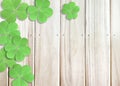 St. Patrick`s Day Background with Green Shamrocks Left top Corner on Wooden Texture