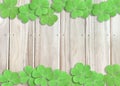 St. Patrick`s Day Background with Green Shamrocks on Wooden Texture