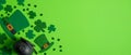 St Patrick`s Day banner design. Irish elf hats, pot of gold and shamrock leaf clovers on green background with copy space. Happy S