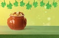St. Patrick`s Day celebration. Pot of gold coins and green clover leaves