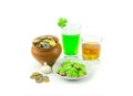 St.Patrick `s Day coins whiskey scotch green beer clover garlic on white background