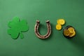 St. Patrick\'s day concept with clover leaf, horseshoe, golden coins on green Royalty Free Stock Photo