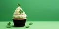 St Patrick's day concept - cupcake with shamrock topper