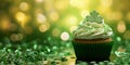 St Patrick's day concept - cupcake with shamrock topper