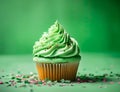 St Patrick\'s day, food and holidays concept. Close up of green cupcakes and bokeh