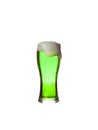 St. Patrick`s Day. A glass of green beer on a white background. Oktoberfest. Glass of light beer isolated on white background Royalty Free Stock Photo