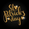 St. Patrick`s Day golden handwritten lettering with shamrock lea