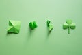 St. patrick`s day. green background with clover leave shamrock. copy space. Paper craft. Step-by-step instructions