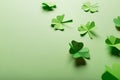 St. patrick`s day. green background with clover leaves: shamrock and four-leafed. copy space.