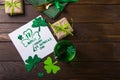 St. Patrick`s Day Green Beer pint over dark green background, decorated with shamrock leaves. Patrick Day pub party, celebrating Royalty Free Stock Photo