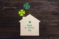 St.Patrick`s day greeting message with home symbol and clover l Royalty Free Stock Photo