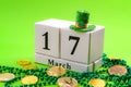 St Patrick`s Day meme and Irish spring holiday concept theme with a block calendar showing the date of March 17, leprechaun hat